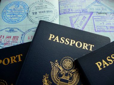 4 passports with a lot of passport stamps