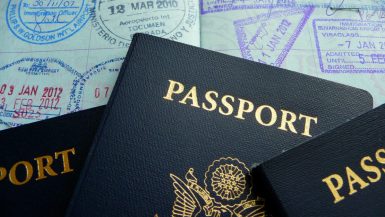 4 passports with a lot of passport stamps