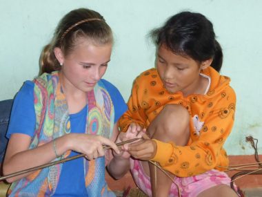 Two girls mat weaving Kim Bong Island