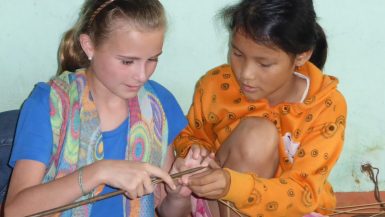 Two girls mat weaving Kim Bong Island