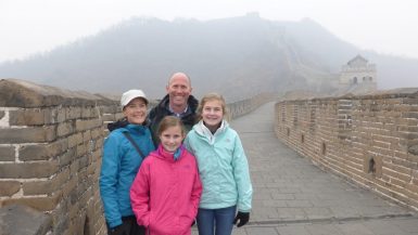 Family standing on the Mutianyu section of the Great Wall