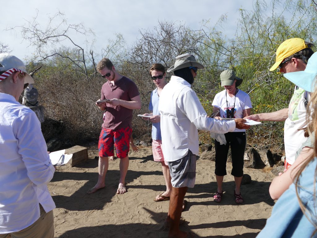 Guide distributes mail to travelers in hopes of finding someone who can deliver the mail to its final destination.