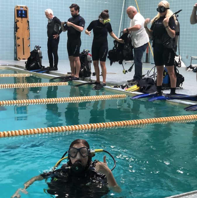 Riley in pool practicing scuba skills