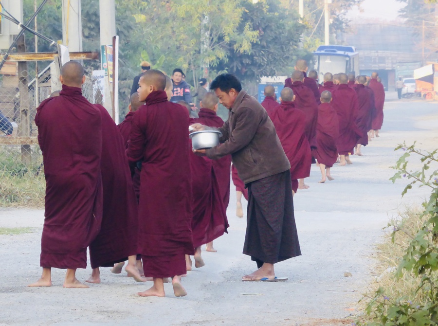 Procession of monks collecting morning alms in Nyaungshwe, Myanmar